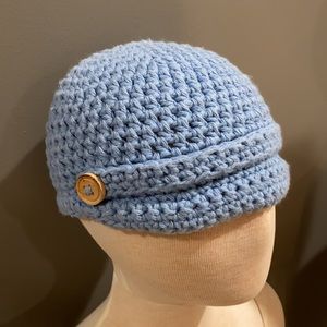 Adorable baby blue knit cap with wood buttons!